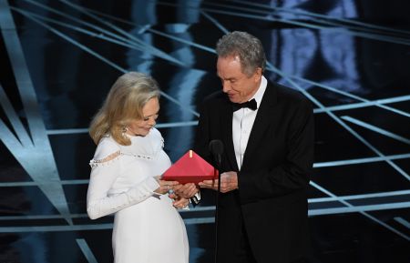 Faye Dunaway and Warren Beatty speak onstage during the 89th Annual Academy Awards