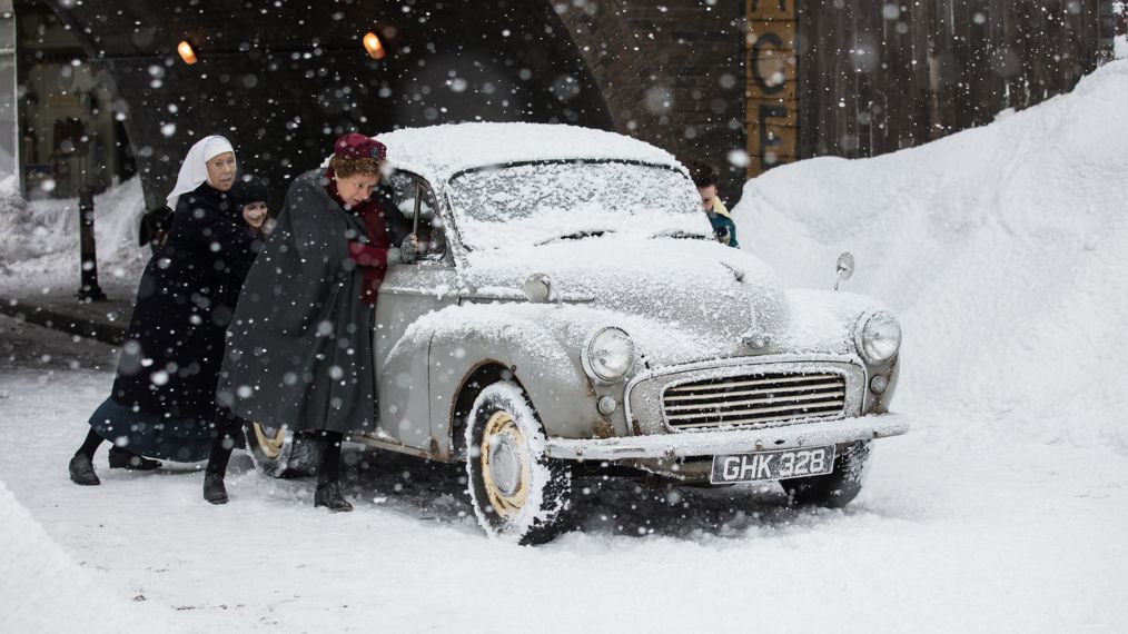 Jenny Agutter as Sister Julienne and Linda Bassett as Nurse Phyllis pushing a car in the snow in Call the Midwife Christmas 2017