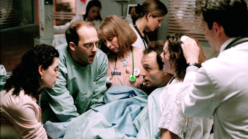 ER- Julianna Margulies as Nurse Carol Hathaway, Anthony Edwards as Dr. Mark Greene, Ellen Crawford as Nurse Lydia Wright, and Sherry Stringfield as Dr. Susan Lewis with the assistance of father (Bradley Whitford) help deliver mother's (Colleen Flynn) baby, and Noah Wyle as medical student Dr. John Carter