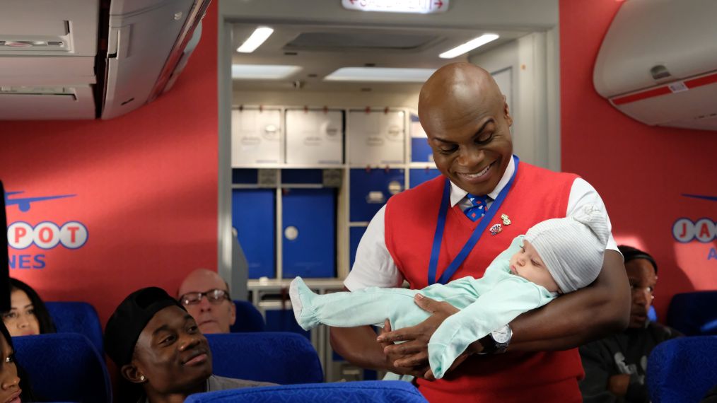 LA To Vegas - Nathan Lee Graham as Bernard holding a baby