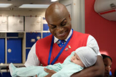 LA To Vegas - Nathan Lee Graham as Bernard holding a baby