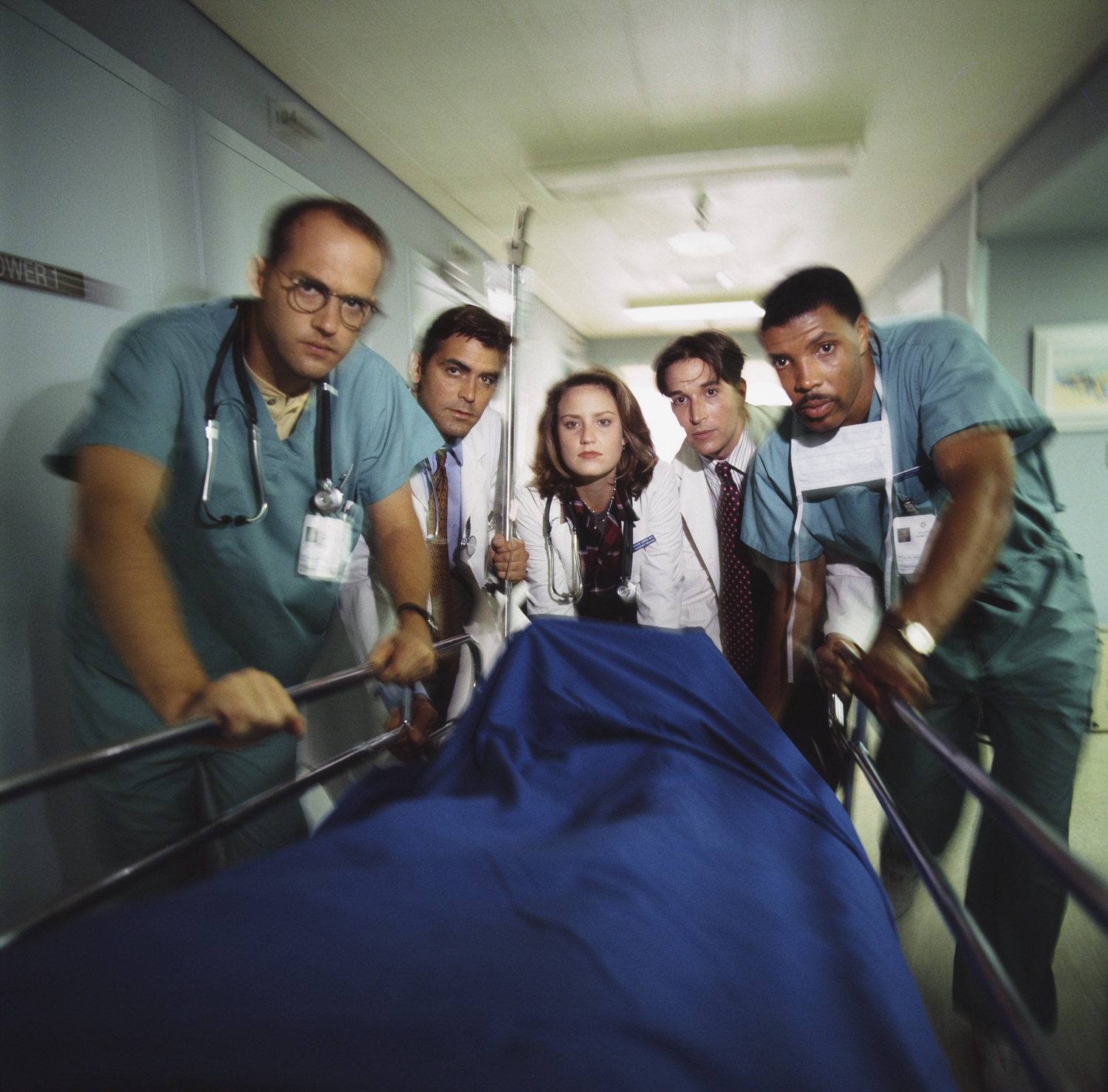 Anthony Edwards as Doctor Mark Greene; George Clooney as Doctor Doug Ross; Sherry Stringfield as Doctor Susan Lewis; Noah Wyle as Doctor John Carter; Eriq La Salle as Doctor Peter Benton in 'ER'