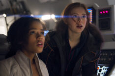 Taylor Russell as Judy Robinson and Mina Sundwall as her sister, Penny, in Lost In Space