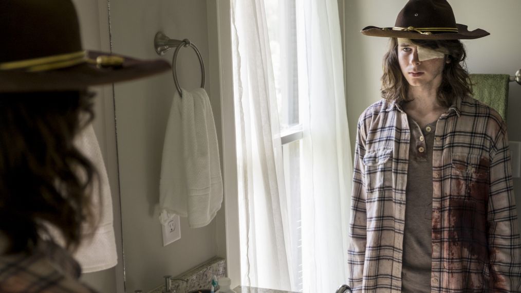 Chandler Riggs as Carl Grimes looking the mirror on 'The Walking Dead'