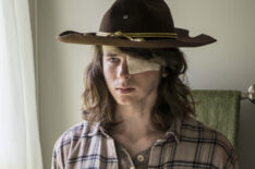 Chandler Riggs as Carl Grimes looking the mirror on 'The Walking Dead'