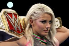 Alexa Bliss holds up her WrestleMania belt