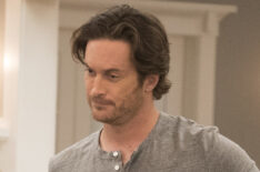 Splitting Up Together - Oliver Hudson holding laundry basket