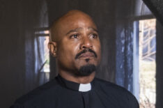 Seth Gilliam as Father Gabriel Stokes using a walking stick in The Walking Dead