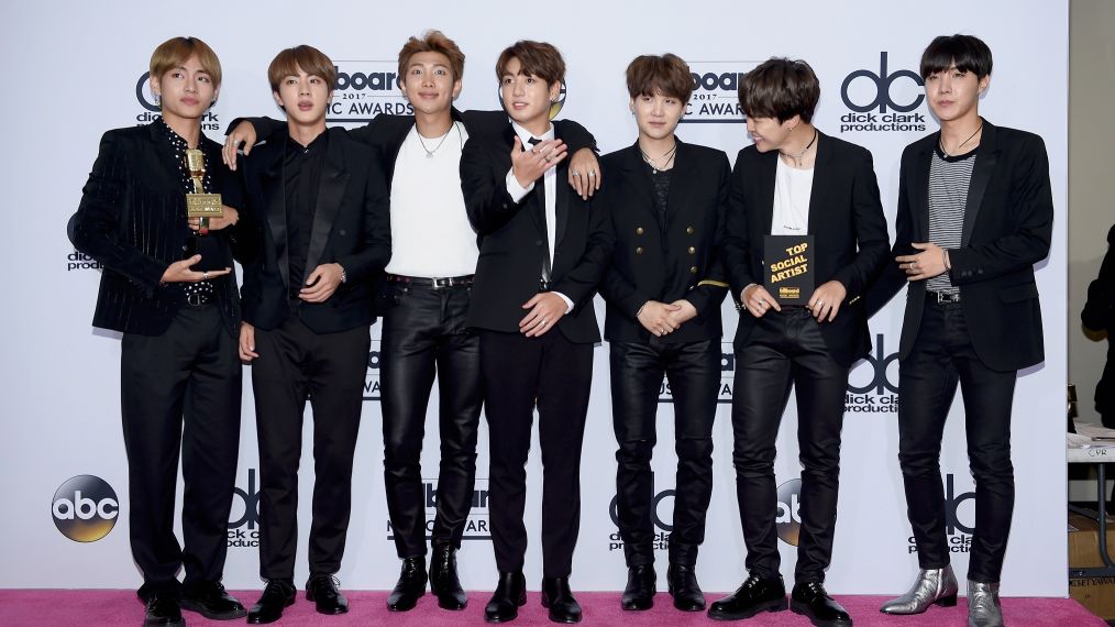 Music group BTS, winner of the Top Social Artist award, pose in the press room during the 2017 Billboard Music Awards
