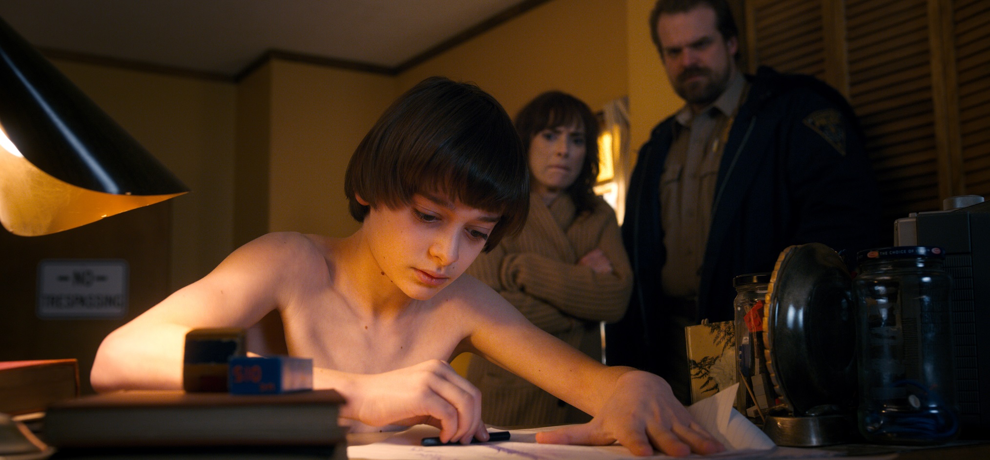Winona Ryder as Joyce Byers and David Harbour as Chief Hopper in Stranger T...