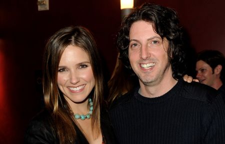 Actress Sophia Bush and creator Mark Schwahn pose at The CW's presentation of An Evening with One Tree Hill