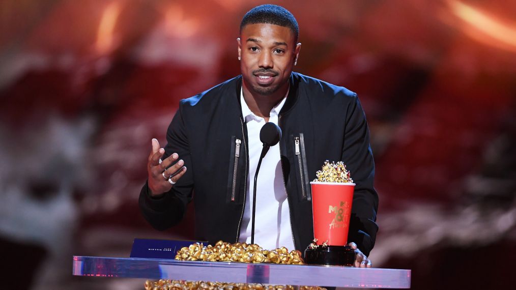 Michael B. Jordan accepts the Best Villain award for 'Black Panther' onstage during the 2018 MTV Movie And TV Awards
