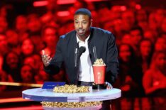 Actor Michael B. Jordan accepts the Best Villain award for 'Black Panther' onstage during the 2018 MTV Movie And TV Awards