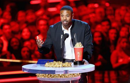 Actor Michael B. Jordan accepts the Best Villain award for 'Black Panther' onstage during the 2018 MTV Movie And TV Awards