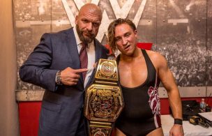 Paul Levesque with United Kingdom champion Pete Dunne