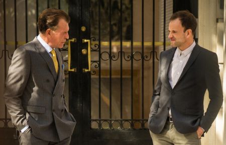 John Noble as Morland Holmes and Jonny Lee Miller as Sherlock Holmes in Elementary