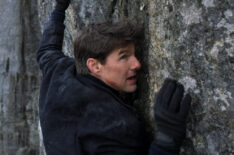 Tom Cruise as Ethan Hunt scaling a mountain in 'Mission: Impossible - Fallout'