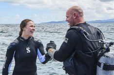 Ronda Rousey and Paul De Gelder pose before their dive beneath the waters off the Fiji coast