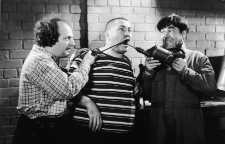 American actors Larry Fine (1902 - 1975) and Moe Howard (1897 - 1975) abuse Curly Howard (1903 - 1952) with tools in a still from an unidentified Three Stooges film. (Photo by Hulton Archive/Getty Images)
