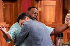 Max Greenfield hugging Cedric the Entertainer in The Neighborhood