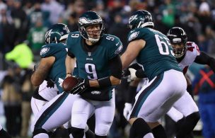 Quarterback Nick Foles #9 of the Philadelphia Eagles runs with the ball against the Atlanta Falcons during the first half in the NFC Divisional Playoff game at Lincoln Financial Field on January 13, 2018 Nick Foles Philadelphia Eagles