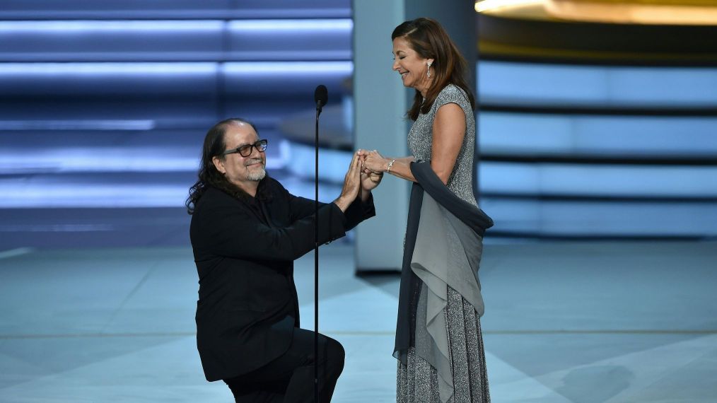 Glenn Weiss (L), winner of the Outstanding Directing for a Variety Special award for 'The Oscars,' proposes marriage to Jan Svendsen onstage during the 70th Emmy Awards at the Microsoft Theatre in Los Angeles, California on September 17, 2018. (Photo by Robyn BECK / AFP) (Photo credit should read ROBYN BECK/AFP/Getty Images)