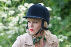 Ashley Jensen as Agatha Raisin riding a bike