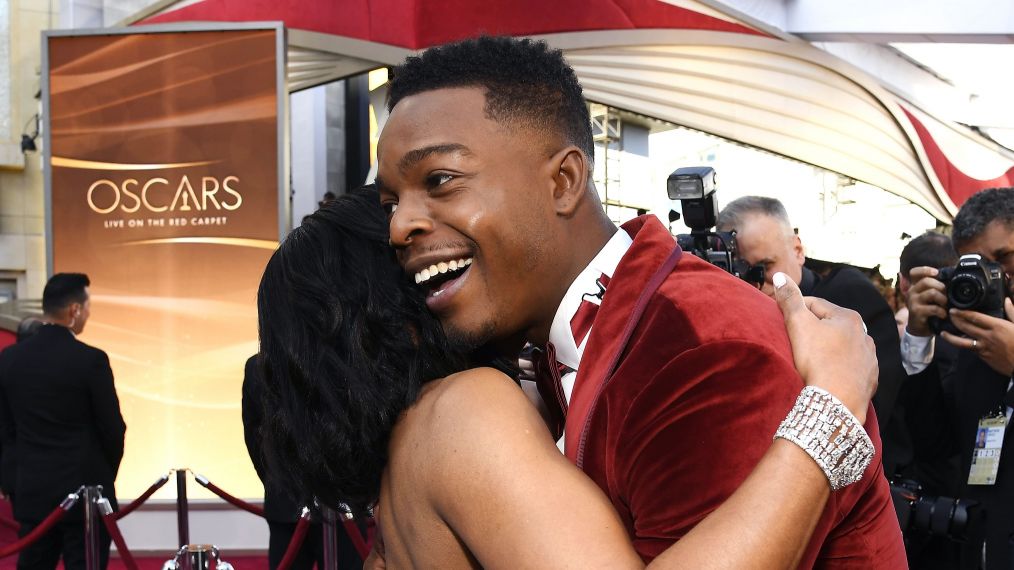 Regina King and Stephan James hug at the 91st Annual Academy Awards in 2019