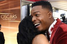 Regina King and Stephan James hug at the 91st Annual Academy Awards in 2019