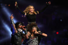 Singer Madonna performs with Redfoo and SkyBlu of LMFAO during the Bridgestone Super Bowl XLVI Halftime Show