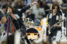 Steven Tyler and Joe Perry of Aerosmith perform during the pre-game show prior to the start of Super Bowl XXXVIII