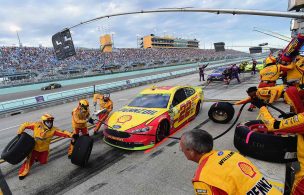 Joey Logano pits during the 2018 season finale race at Homestead-Miami Speedway. Logano won both the race and the 2018 Monster Energy NASCAR Cup Series championship. Joey Logano, NASCAR
