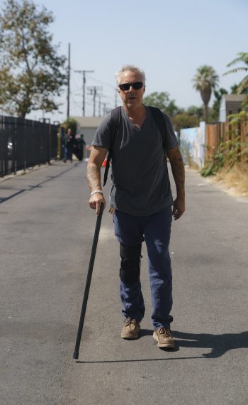 Titus Welliver on a walking cane in Bosch