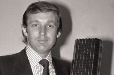 Donald Trump holding model of tower