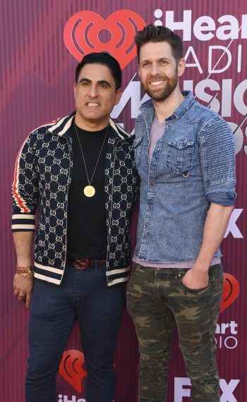 Reza Farahan and Adam Neely attend the 2019 iHeartRadio Music Awards
