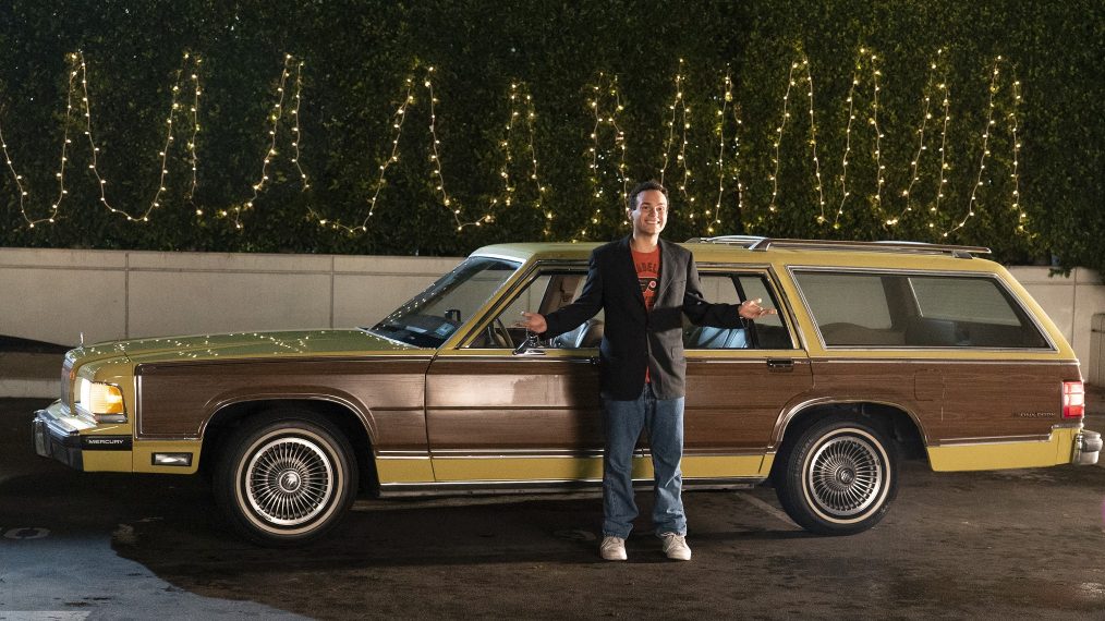 Troy Gentile in front of a station wagon The Goldbergs