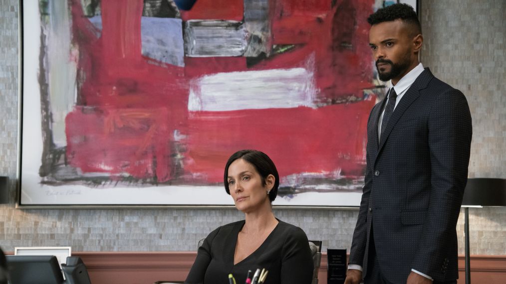 Jeri (Carrie-Anne Moss) and Malcolm (Eka Darville) in Marvel's Jessica Jones