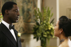 Isaiah Washington as Preston Burke and Sandra Oh as Cristina Yang in Grey's Anatomy