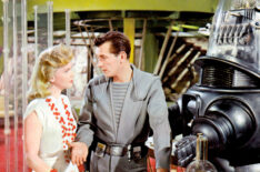 Forbidden Planet - Anne Francis as Altaira Morbius, Leslie Nielsen as Cmmr. James J. Adams, and Robby the Robot voiced by Marvin Miller