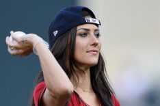 Becca Kufrin throws a pitch at the Kansas City Royals v Minnesota Twins game