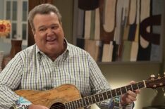 Eric Stonestreet playing guitar in Modern Family