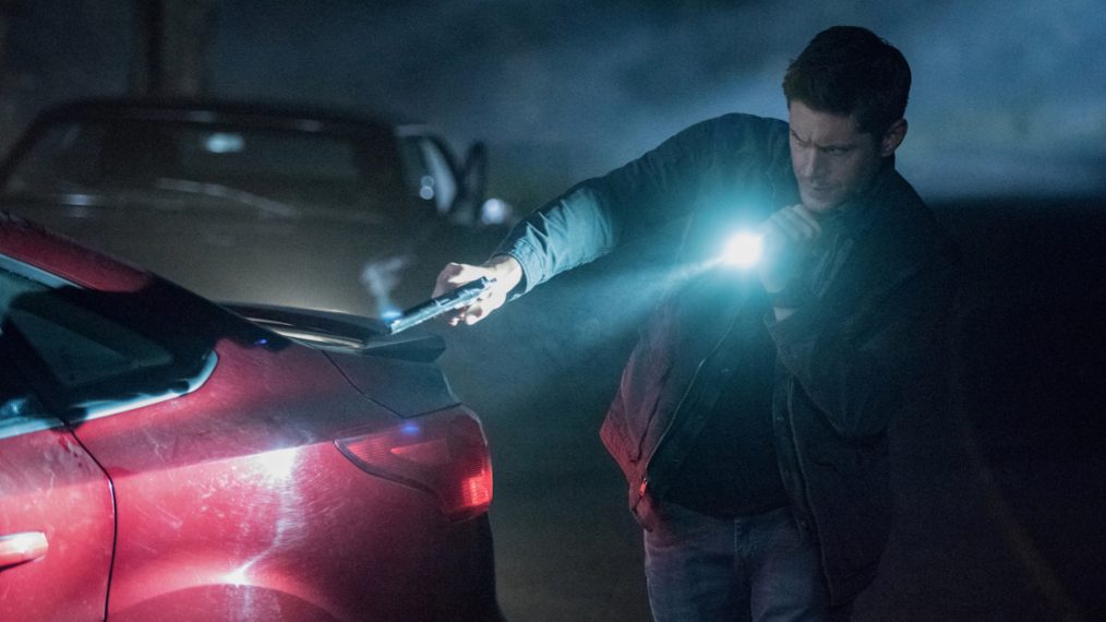 Jensen Ackles as Dean shining a flashlight in Supernatural - 'Back and to the Future'