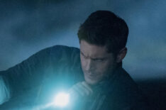 Jensen Ackles as Dean shining a flashlight in Supernatural - 'Back and to the Future'