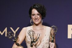 Phoebe Waller-Bridge poses with awards for Outstanding Comedy Series, Outstanding Lead Actress in a Comedy Series, and Outstanding Directing for a Comedy Series in the press room during the 71st Emmy Awards