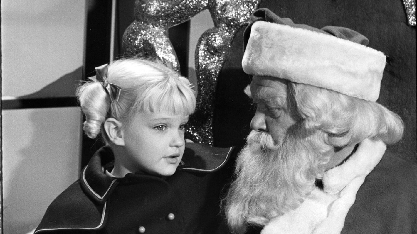 Susan Olsen as Cindy and Hal Smith as Santa Claus in The Brady Bunch