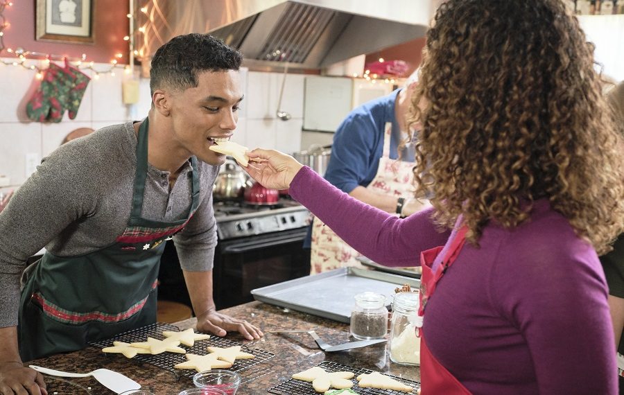 Rome Flynn being hand-fed by Chaley Rose in A Christmas Duet