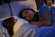 Victoria Park as Kamilla and Carlos Valdes as Cisco Ramon in bed in The Flash