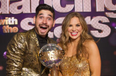 Alan Bersten and Hannah Brown hold the trophy on Dancing With The Stars