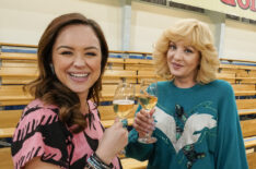 Hayley Orrantia and Wendi McLendon-Covey toast to the 150th episode of The Goldbergs