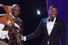 Wayne Brady and host Nick Cannon in the Masked Singer